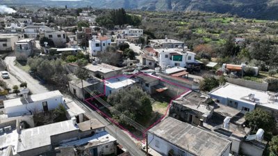 Three plots with stone-built houses in Giolou, Paphos