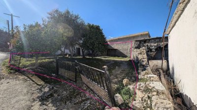 Three plots with stone-built houses in Giolou, Paphos