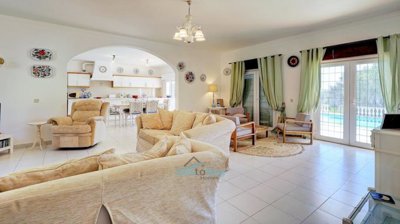 living room with patio doors to pool terrace