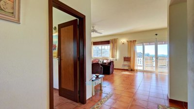 entrance hall and views through lounge to valley beyond