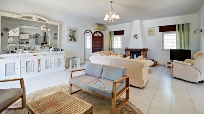 living room with wood buring fireplace